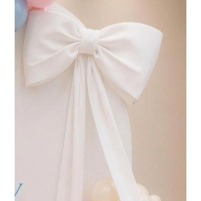 Large fabric bow with tails